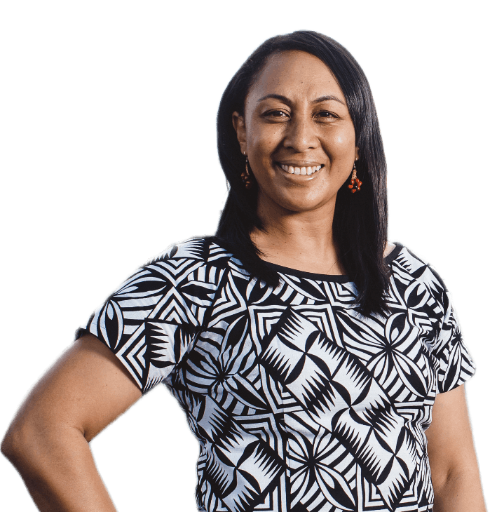 woman standing, smiling at camera