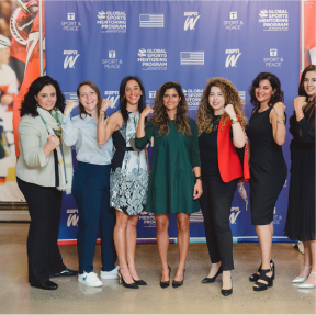 g-1 group of women with flexed arms showing muscles